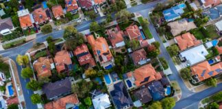 U.S. Home Sales Decline Heavily in February Rooftops of homes