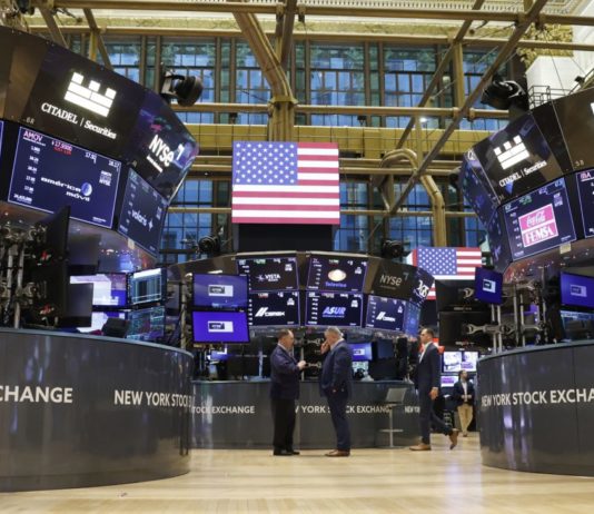 U.S. Stock Soar to New Records, Dow Jones Rise By More Than 1,500 Points Traders work on the floor of the New York Stock Exchange on Wall Street in New York City in 2022