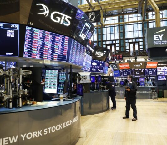 Traders work on the floor of the NYSE in September 2022