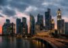Singapore unexpectedly tightens policy again as oil jump revives inflation concerns